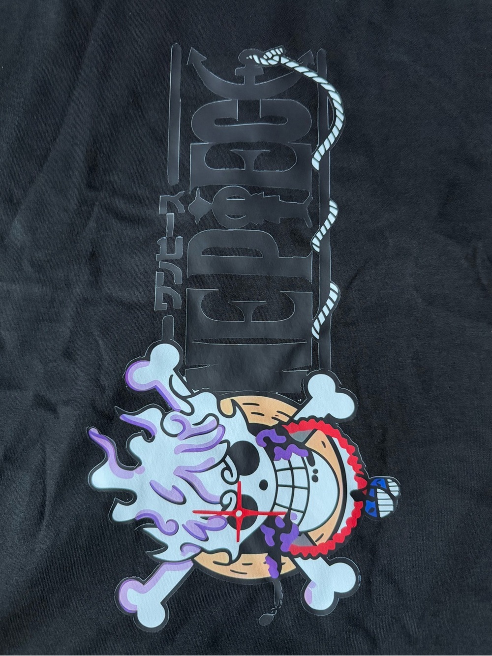 ONE PIECE - Black Graphic Tee with Multicolor Skull Emblem